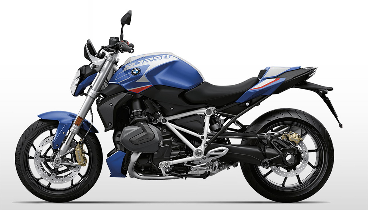 Et billede, der indeholder motorcykel, udendørs, vej, parkeret
Automatisk genereret beskrivelse