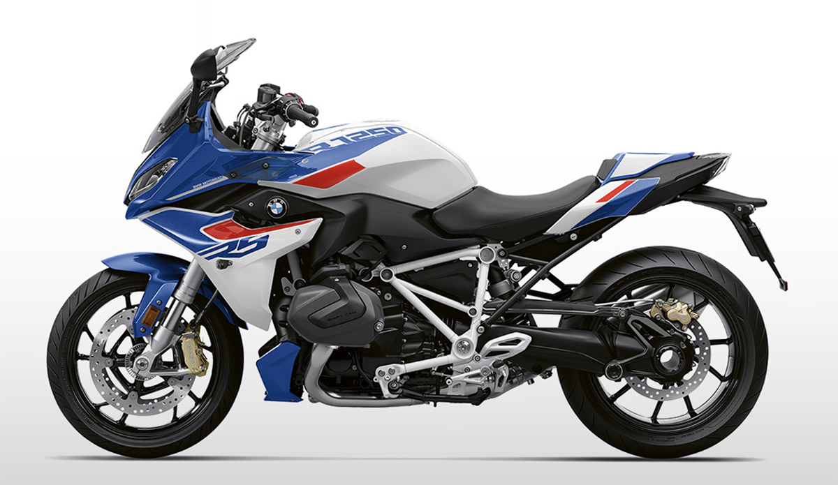 Et billede, der indeholder motorcykel, udendørs, blå, motorcykling
Automatisk genereret beskrivelse