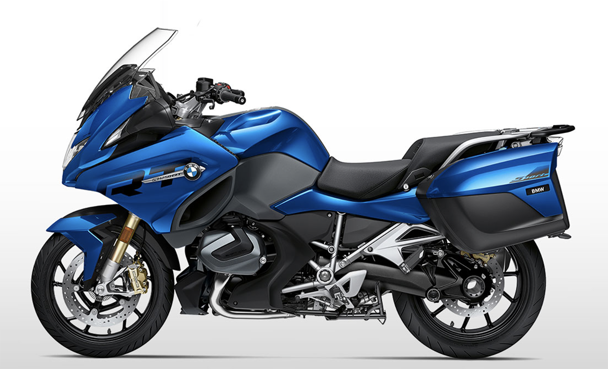 Et billede, der indeholder motorcykel, udendørs, blå, parkeret
Automatisk genereret beskrivelse