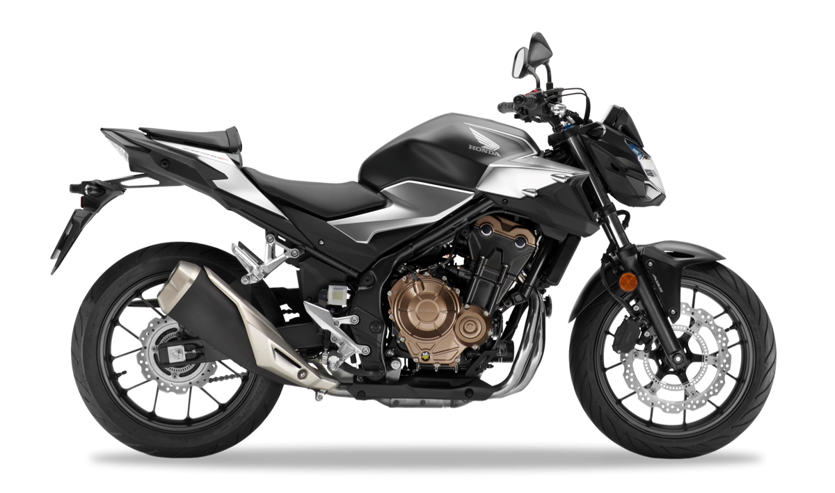 Et billede, der indeholder motorcykel, parkeret, udendørs, beton
Automatisk genereret beskrivelse